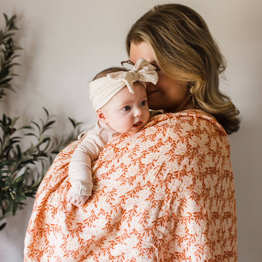 Pink Daisy Baby Swaddle | One Canoe Two Paper Co.