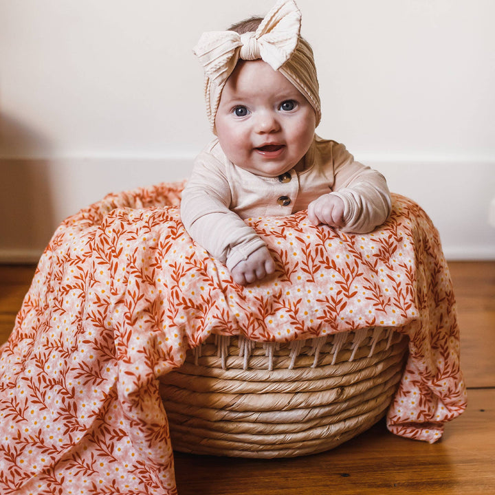 Pink Daisy Baby Swaddle | One Canoe Two Paper Co.