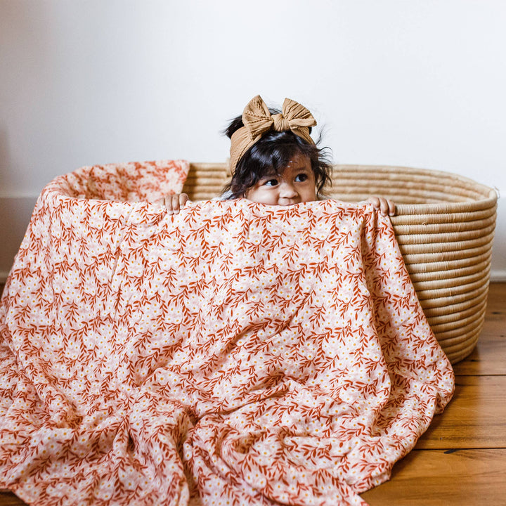 Pink Daisy Baby Swaddle | One Canoe Two Paper Co.